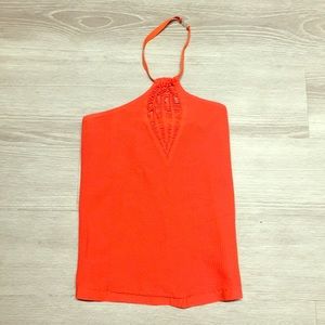 Bright orange form fitting Scala halter top